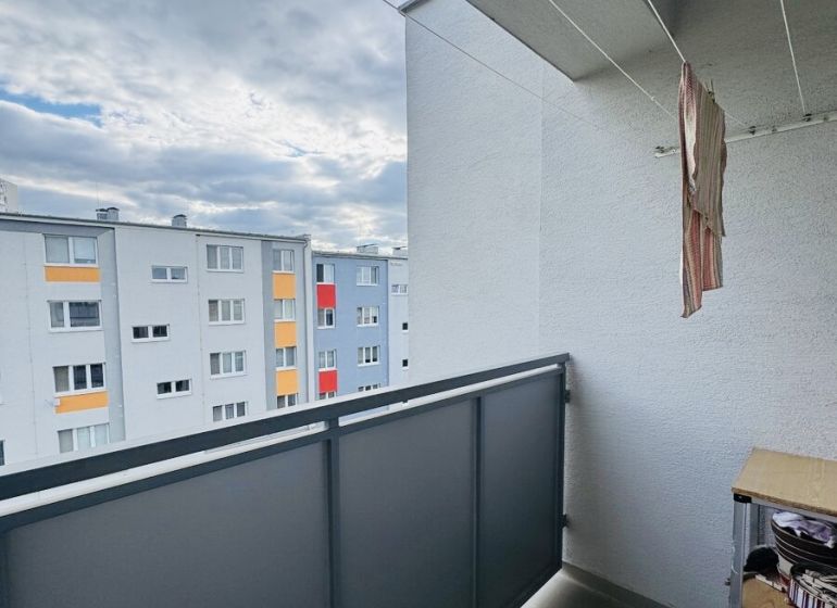 The balcony of a 3-room apartment on Za poštou Street in Hlohovec with a view of the housing estate.
