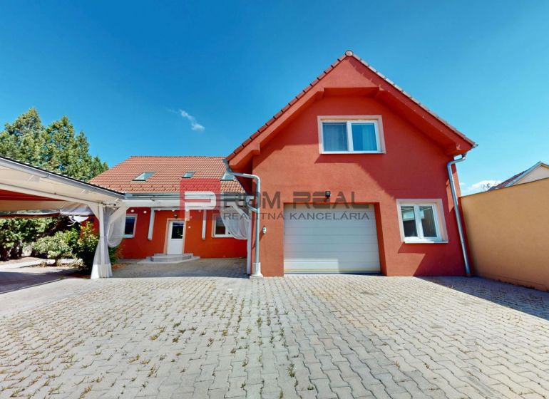 Family house on Gútorská Road in Šamorín with a garage and a paved courtyard.
