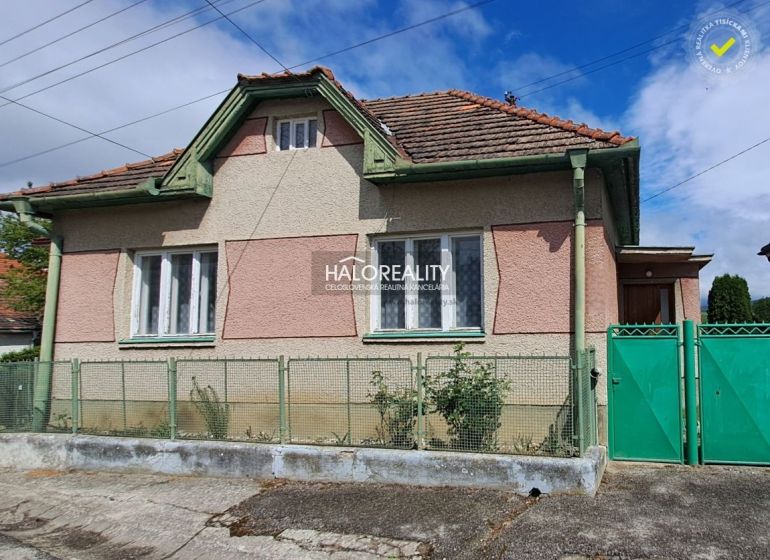 A family house in Veľké Kršteňany with a fence and traditional architecture.
