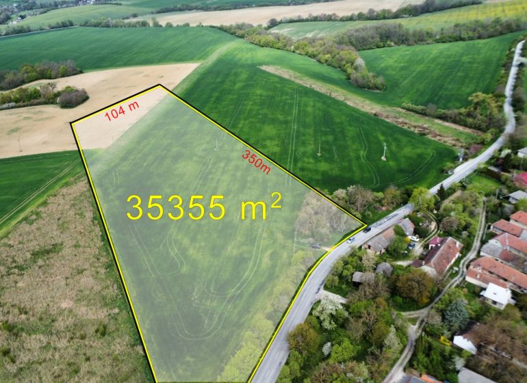 Aerial view of agricultural and forest land in Prašník on Grnča Street.
