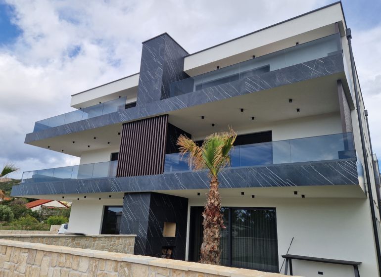 A recreational apartment in Stara Novalja with modern architecture and spacious terraces.