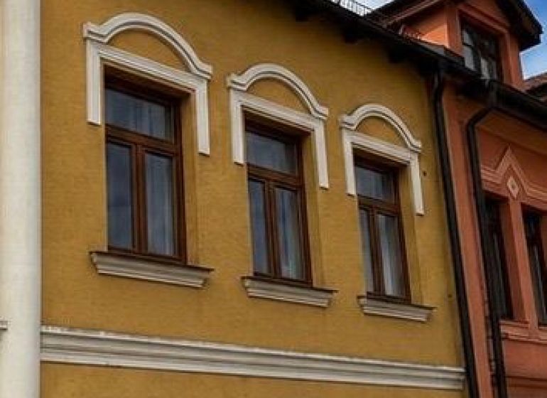 The building with a colorful facade and arched windows is located in Topoľčany.