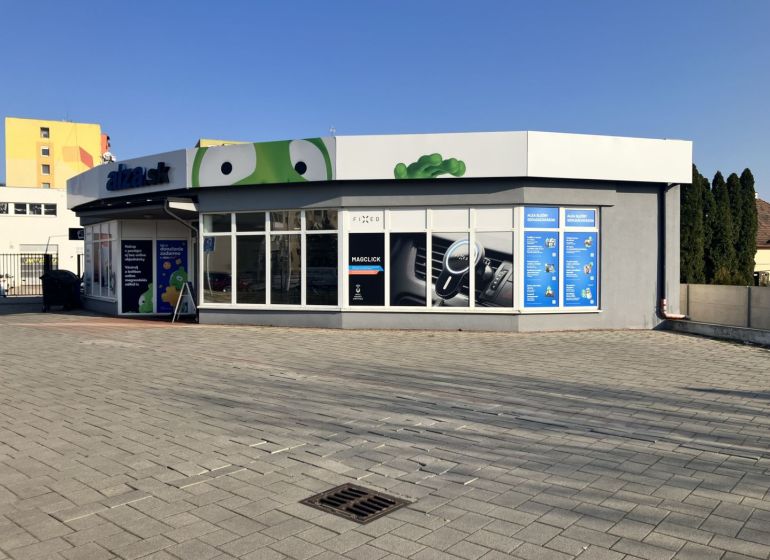 Commercial premises in Dunajská Streda with a modern exterior and large glass display windows.