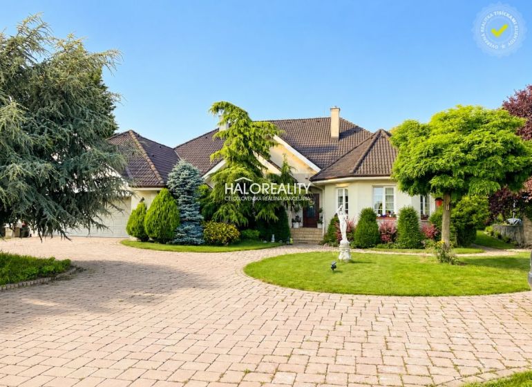 A family house in Žabokreky nad Nitrou with a well-maintained garden and a spacious driveway.