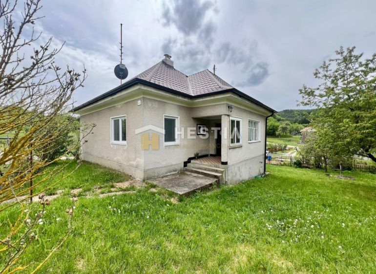 A family house in Myjava with a garden, satellite dish, and a staircase leading to the terrace.