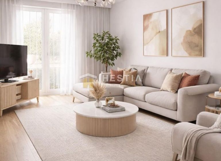 Living room in a three-room apartment with a wooden decor floor and light furniture.