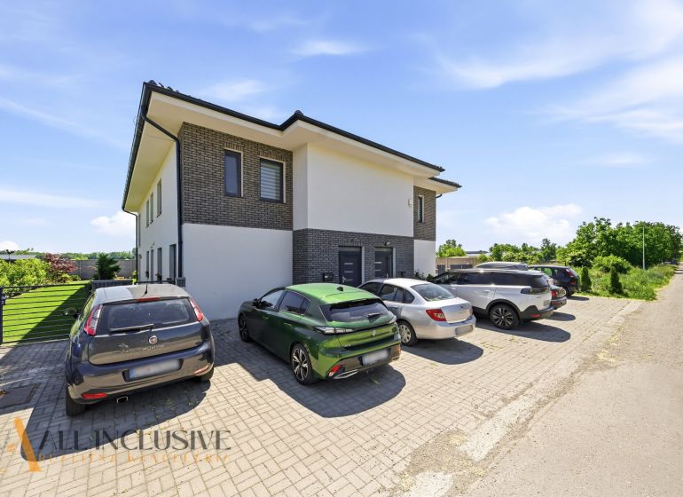 Parking lot near a two-story house with greenery in the town of Horný Bar, 3-room apartment.