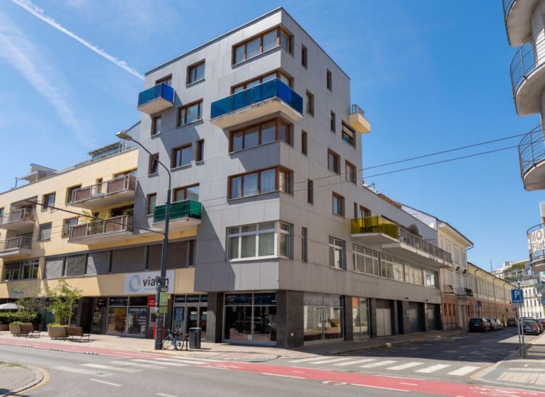 An apartment building on Dunajská Street in Bratislava offering 4-room apartments with balconies.