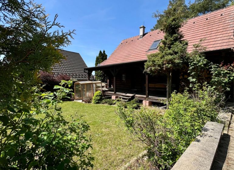 A family house at Devínske Jazero in Bratislava with a garden and a greenhouse.
