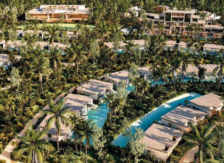Luxury villas in Nungwi surrounded by palm trees and tropical vegetation.