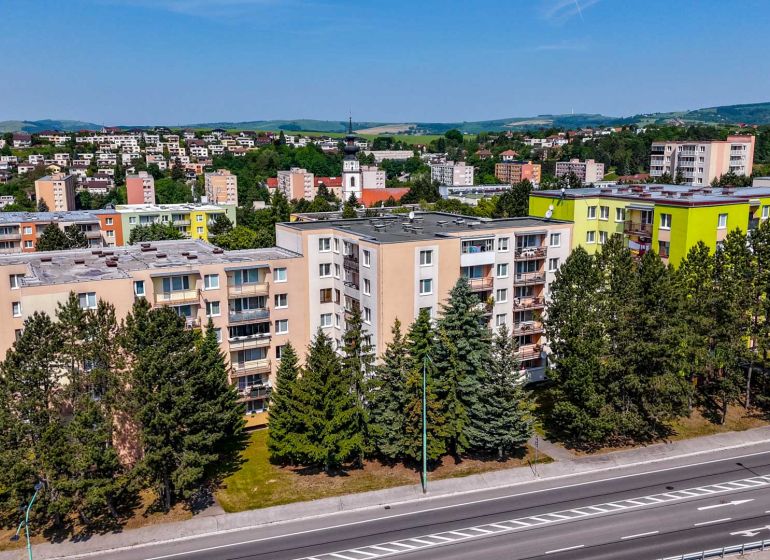 A view of apartment buildings and nature on Viestova Street in the town of Myjava.