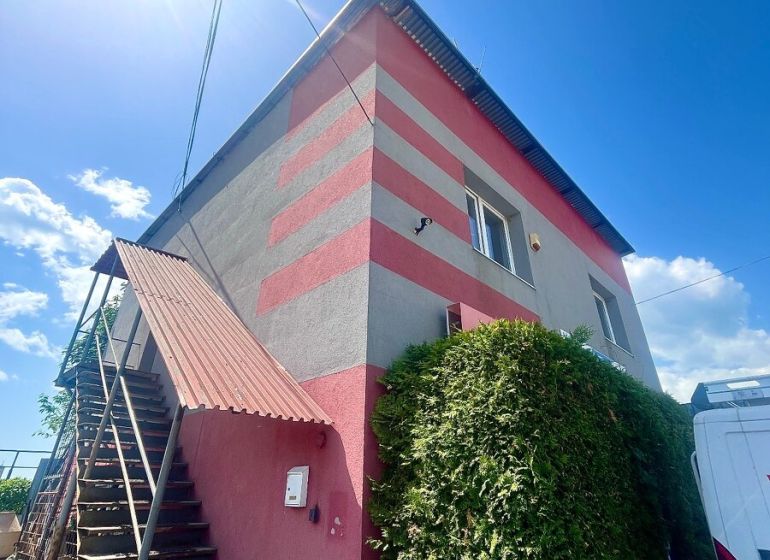 Commercial premises in Košice - Sever district, decorated with colorful stripes, external stairs.