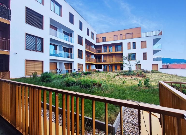 Apartment building on Piaristická Street in Nitra with an inner green courtyard.