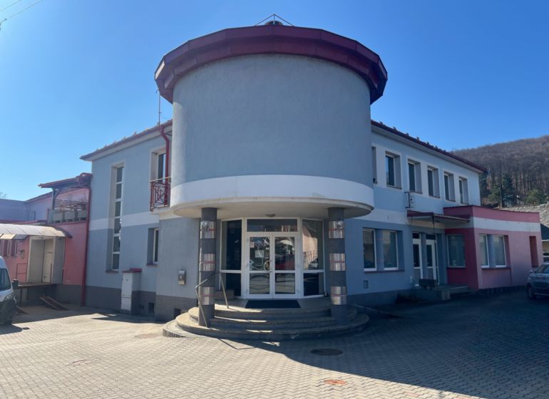 Building with an arched entrance in Kremnička, Banská Bystrica, serving as warehouses and halls.