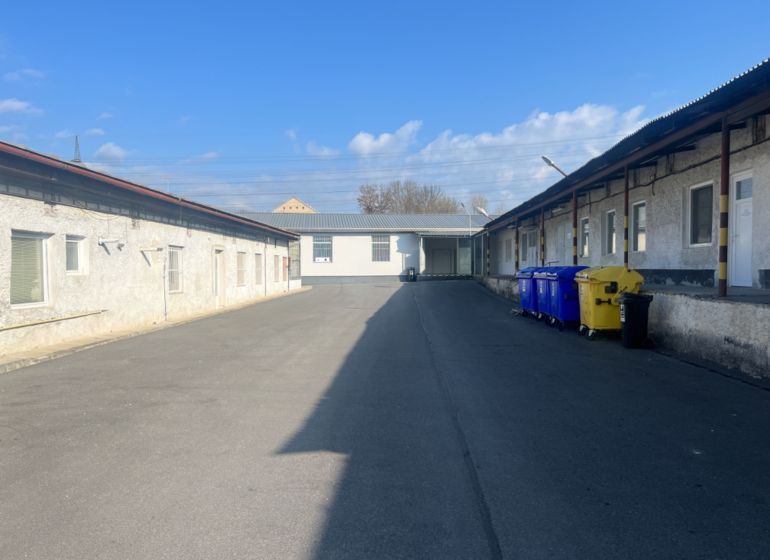 Exterior Warehouses and halls with colorful containers in Banská Bystrica, Cementárenská cesta.