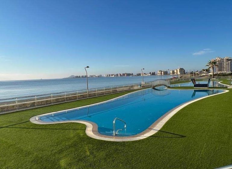 Recreational apartment in La Manga del Mar Menor, Spain, with a pool by the sea.
