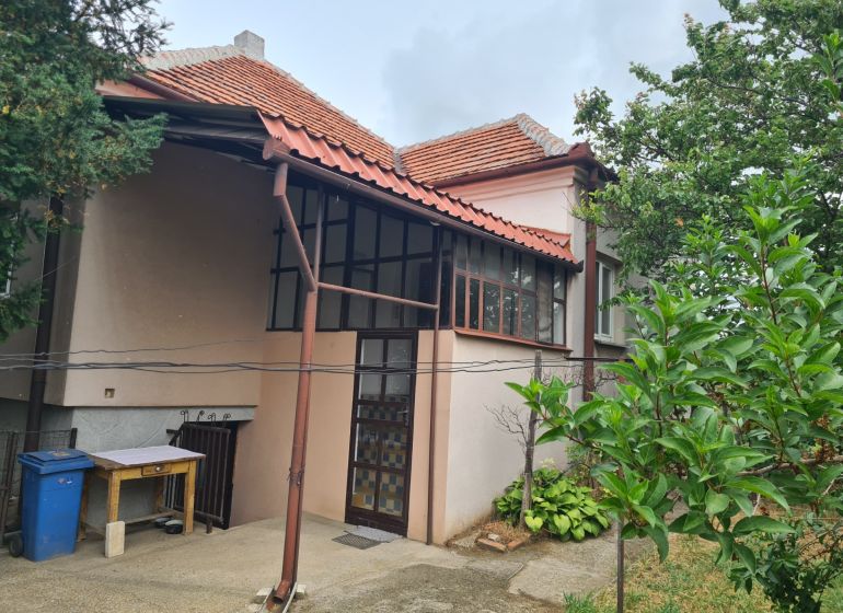 A family house in Dulovce with a terrace, garden, and traditional pitched roof.
