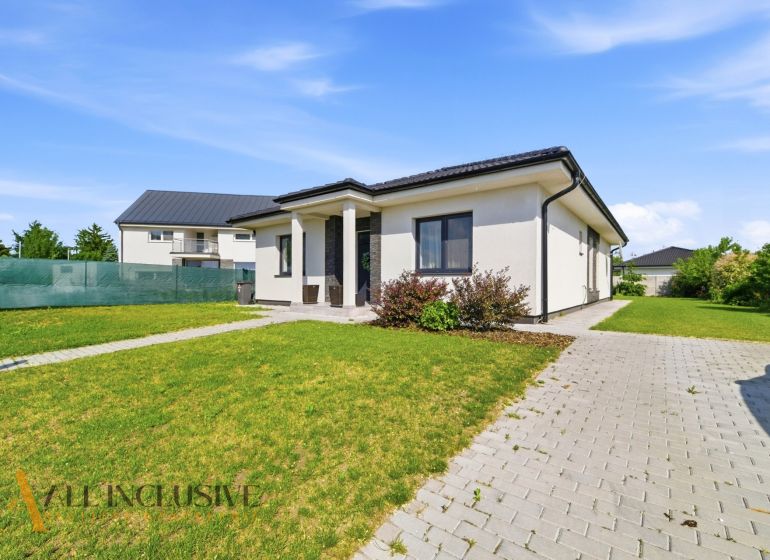 A family house in Veľké Blahovo in Dunajská Streda with a grassy plot and a paved walkway.