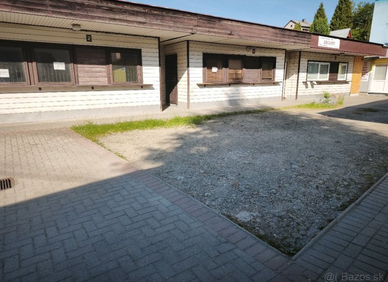 Commercial premises in Turzovka with a simple facade and paved access.