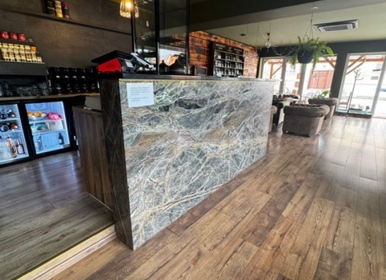 Commercial premises with a stylish interior, wood-patterned flooring, modern design.