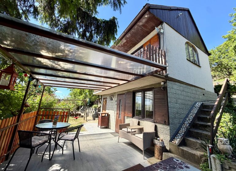 A cottage on Kunov Street in Senica with outdoor seating and garden furniture.