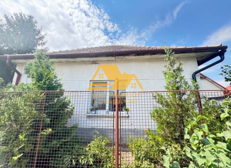 Family house in Imeľ on Imeľ Street, fencing and greenery.