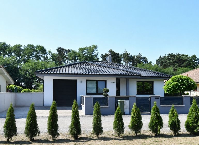 A family house in Šajdíkovce Humence, with a garage and a landscaped garden.