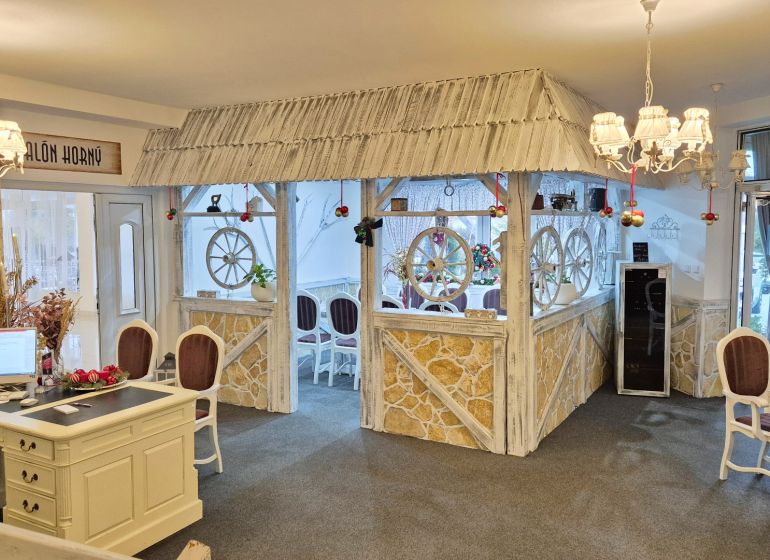 Hotel interior with decorative elements, vaulted ceilings, and ambient lighting.