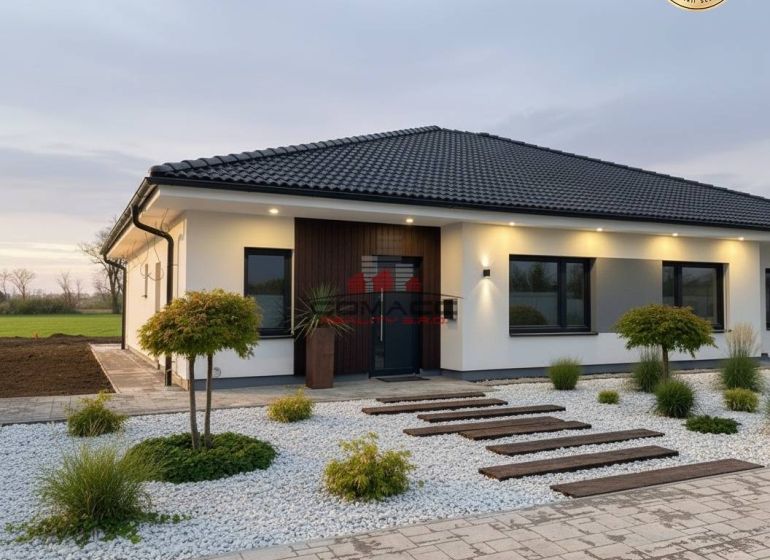 A family house on Ducovska Street in Moravany nad Váhom with a minimalist garden and pebbles.