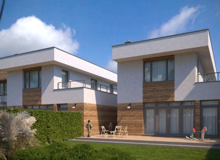 Family houses on Lužianska Street in Senec, bright facades, terrace with seating and plants.