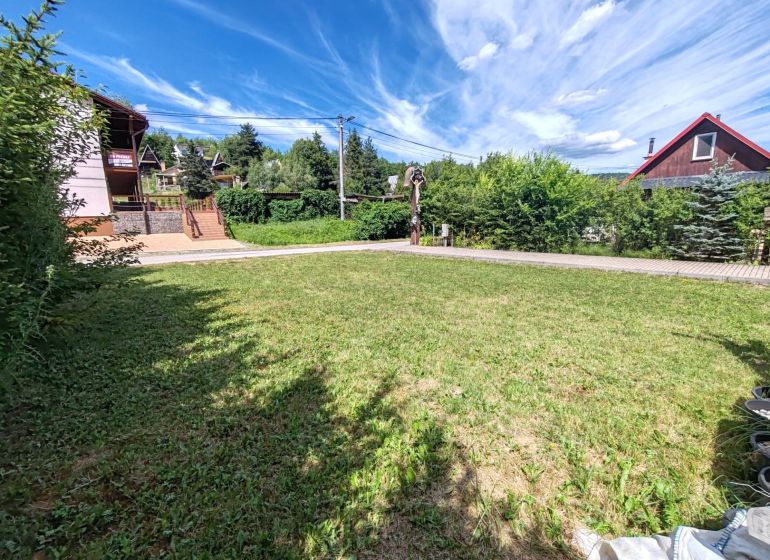 Recreational plots in Bžany at Valkov with grassy areas and surrounding greenery.