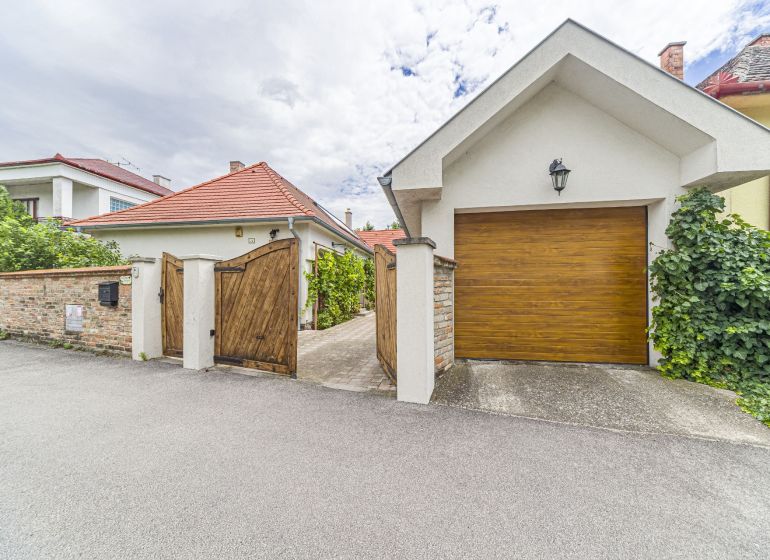 A family house on Čigérska Street in Dunajská Streda with a wooden gate.