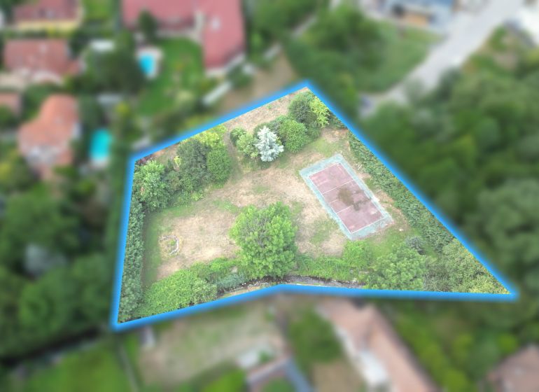 Aerial footage shows a plot of land on Krátka Street in Limbach, suitable for living.