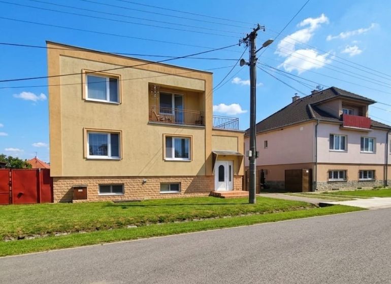 A family house in Lakšárska Nová Ves with a nice garden and a sunny facade.