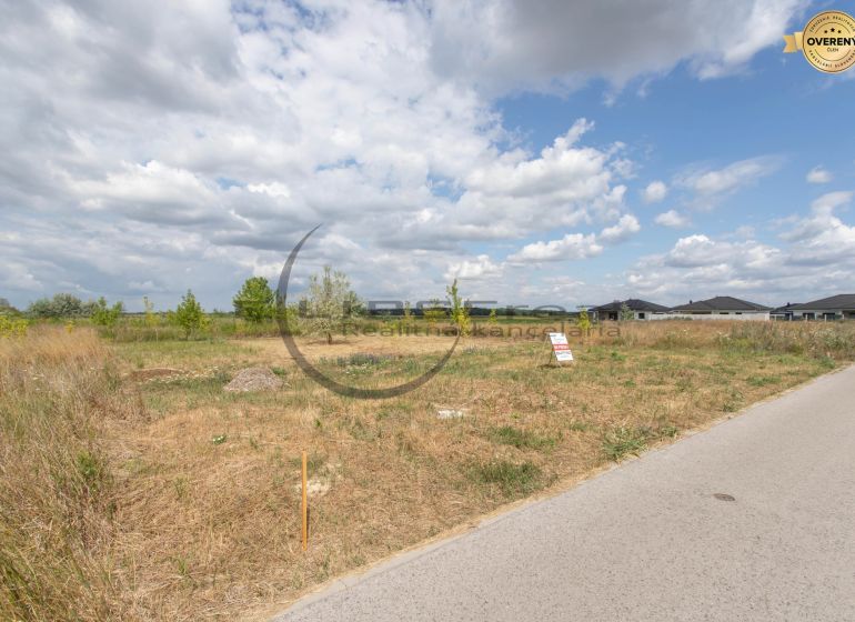 A residential plot on Brezová Street in Zohor, with a view of the surrounding houses.