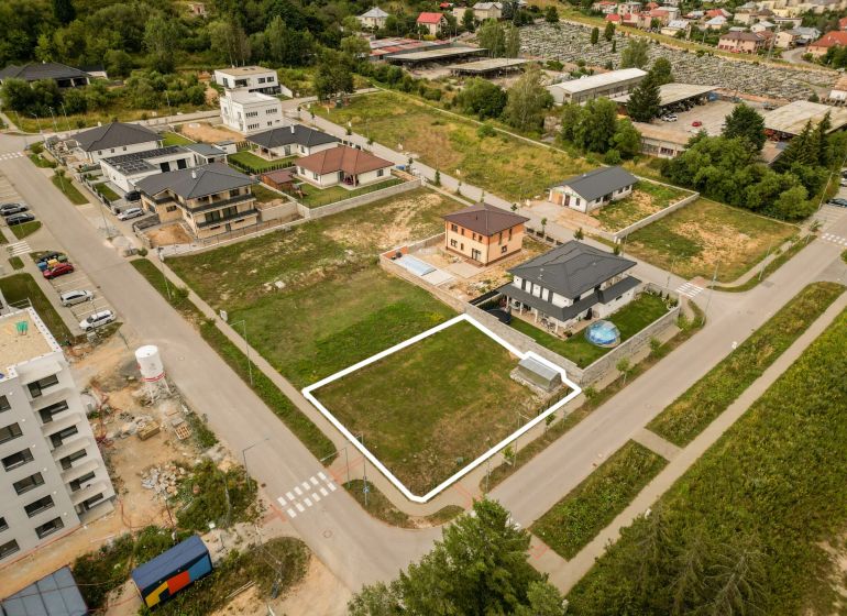 Aerial view of properties - housing in Brezno, Štvrť kasárne, surrounded by development and nature.
