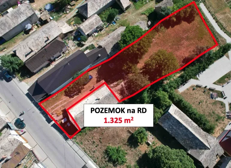 Aerial view of a residential plot in Hrnčiarska Ves, fenced, with surrounding houses.