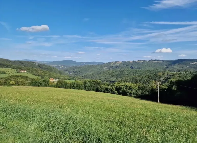 Extensive agricultural and forest lands in Petrova Lehota with views of the hills.