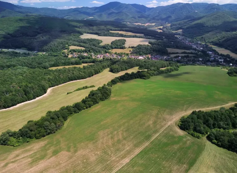 Panorama of agricultural and forest lands in Žitná - Radiša with a view of the mountains.