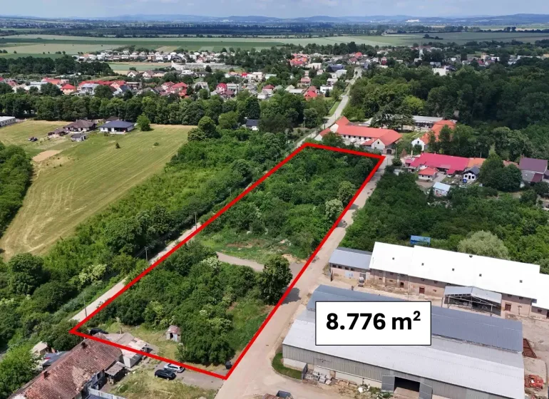 Aerial view of residential plots in Parchovany, surrounded by greenery.