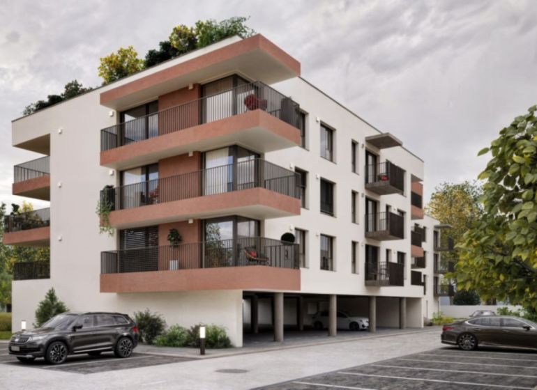 Three-story apartment building with balconies on Brigádnicka Street in Piešťany.