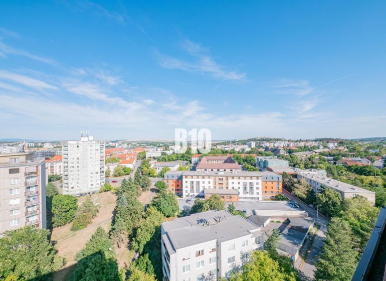 View from a 3-room apartment of the city of Nitra, with diverse architecture and greenery.
