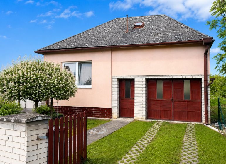 A family house on Gardom Street in Veľký Šariš with traditional architecture and a garden.