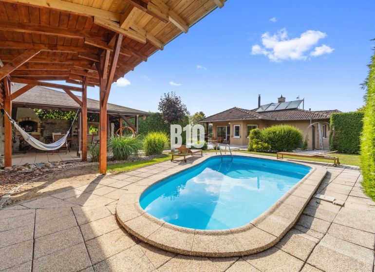 A family house in Nitra with a swimming pool, terrace, and a gazebo in the garden.