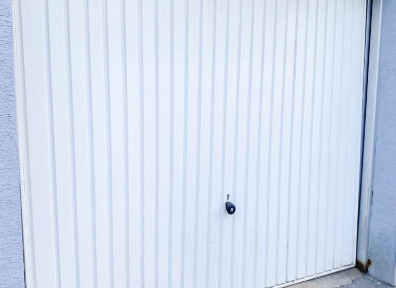 White garage door on Belanská, Košice - Staré Mesto district.