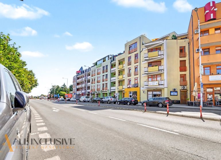 Galantská cesta Street in Dunajská Streda with parked cars and apartment buildings.