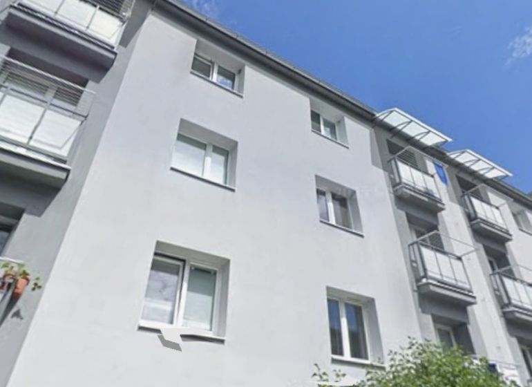 The exterior of the apartment building in Harmanec, Banská Bystrica, offers a 2-room apartment with a balcony.