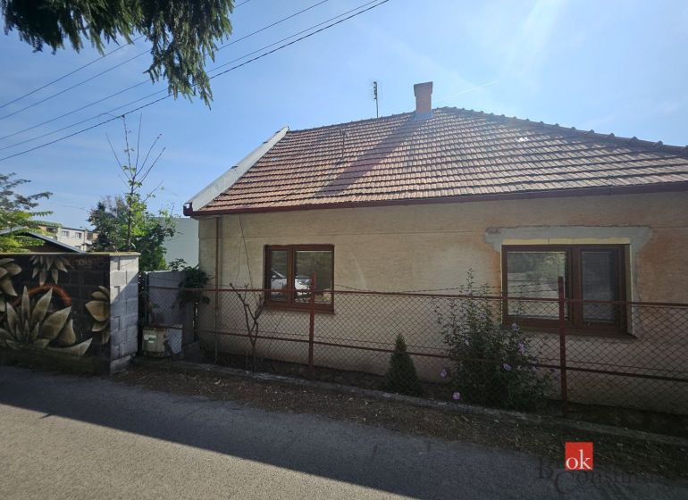 A family house on Stračia Street in Nitra with a white facade and a sloped roof.