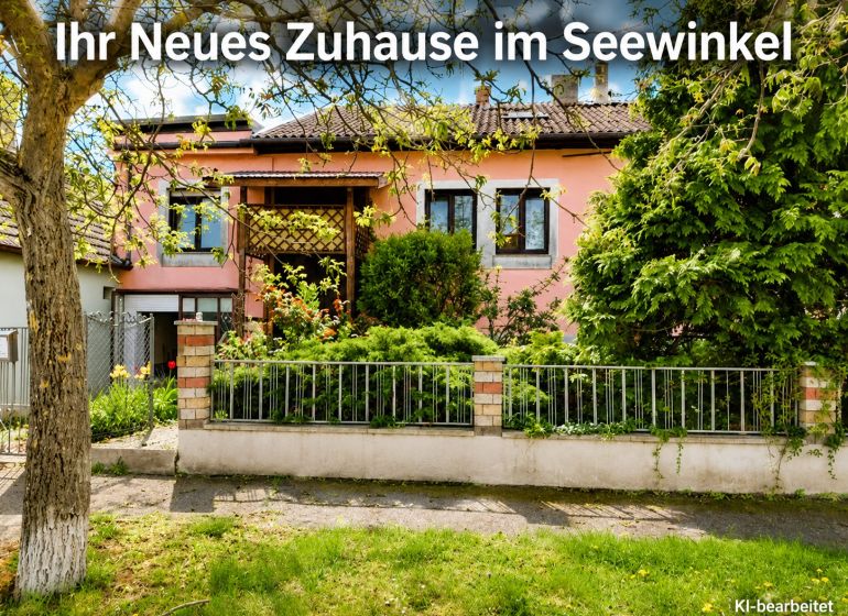 A family house in Illmitz with a pink facade and a green front garden full of plants.