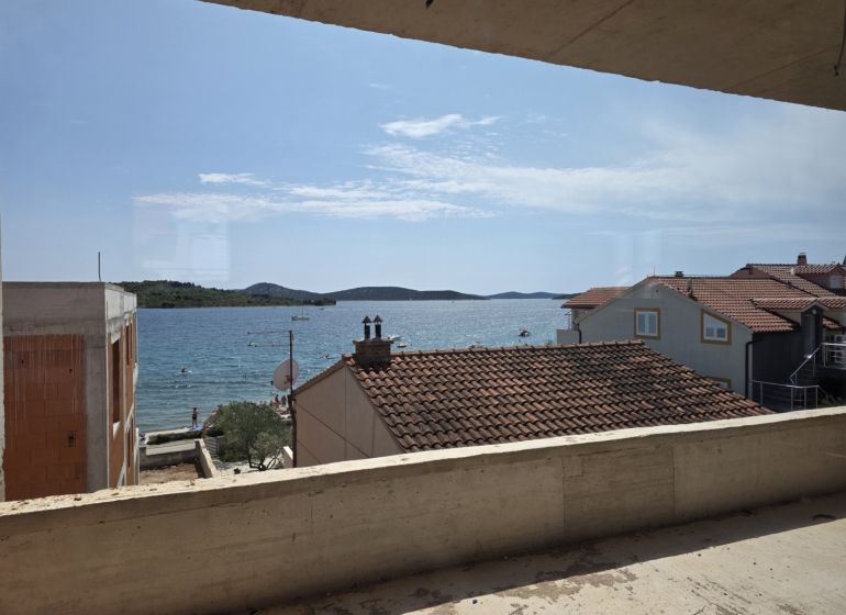 View from a 3-bedroom apartment in Srima of the sea and the beach under the yellow house.